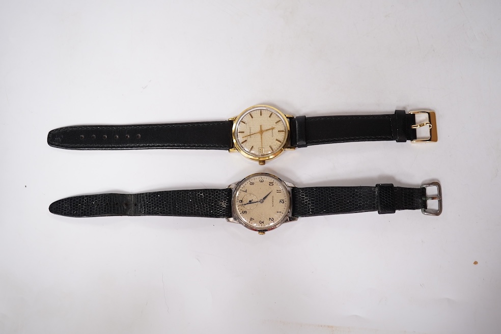 A gentleman's steel and gold plated Longines Conquest manual wind wrist watch, with baton numerals and date aperture, case diameter 35mm, together with a gentleman's stainless steel Marvin manual wind wrist watch, case d